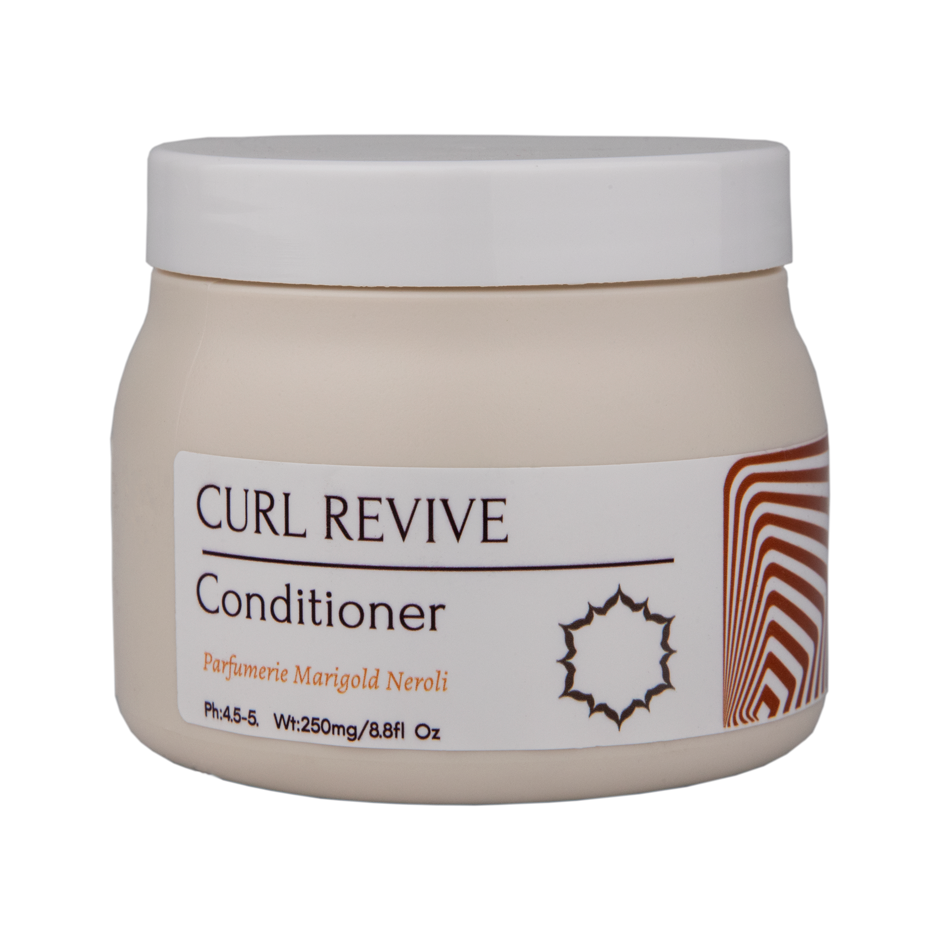 Curl Revive Conditioner for curly hair. Enriched with mango butter, glycerin, and vitamin B5, it defines curls and hydrates with a Neroli Marigold scent.